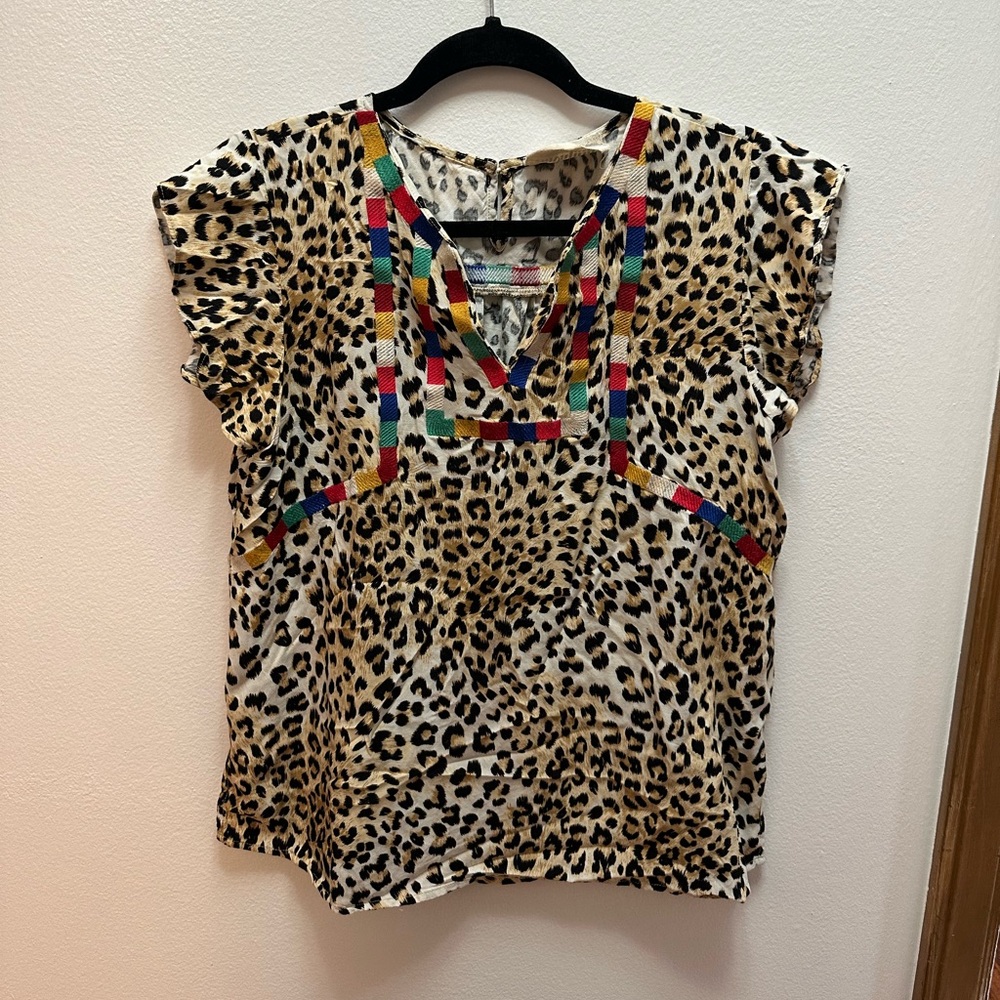 Adorable leopard shirt with multi color stitch detail